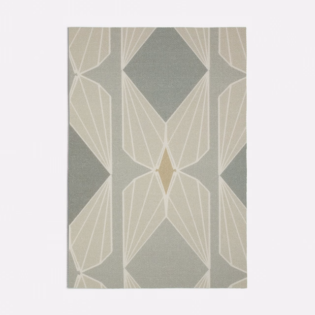 Muted seafoam woven fabric with ivory Art Deco fans and deeper green diamonds