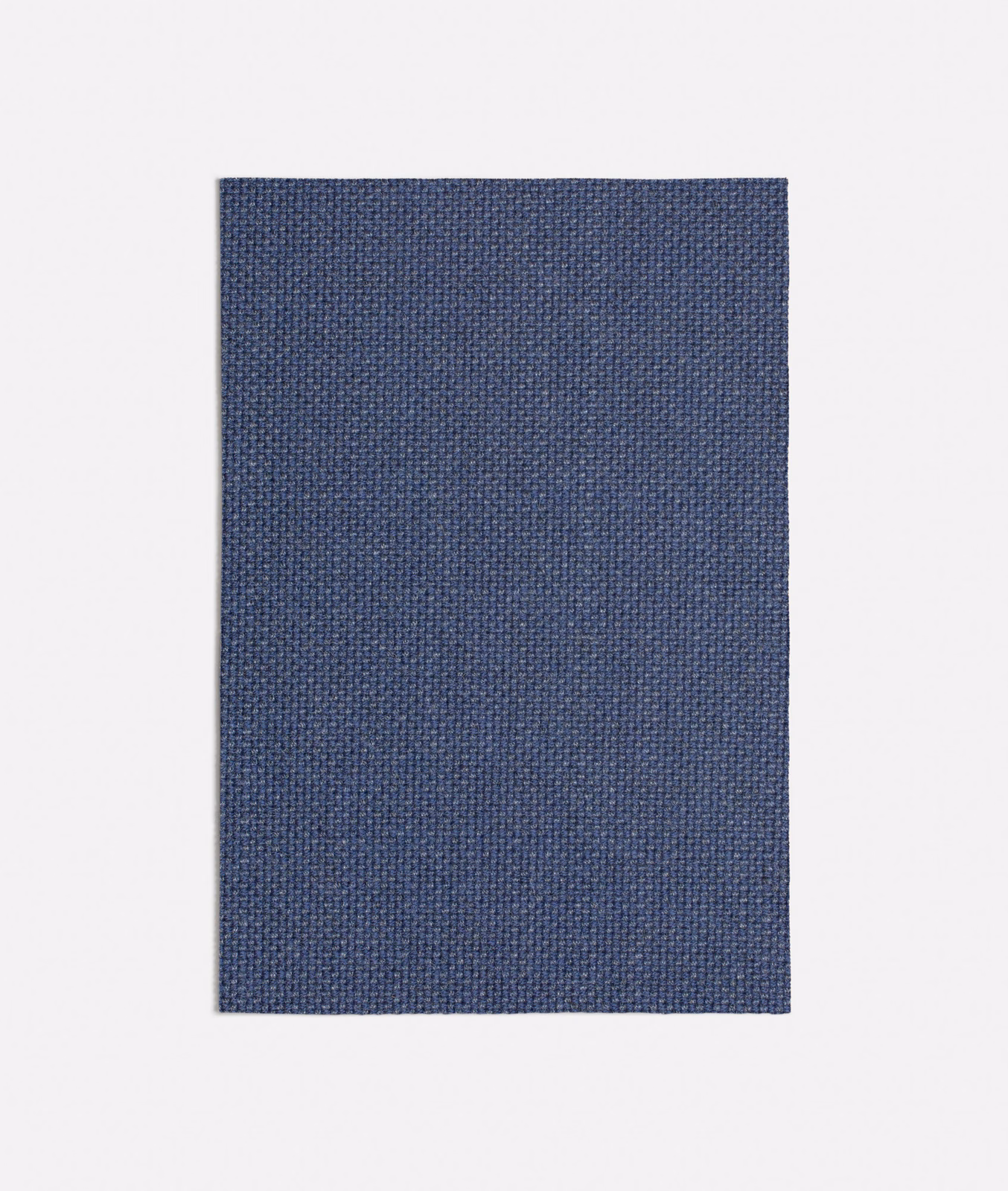 Deep slate-blue textile showing a fine, tightly woven crosshatch surface