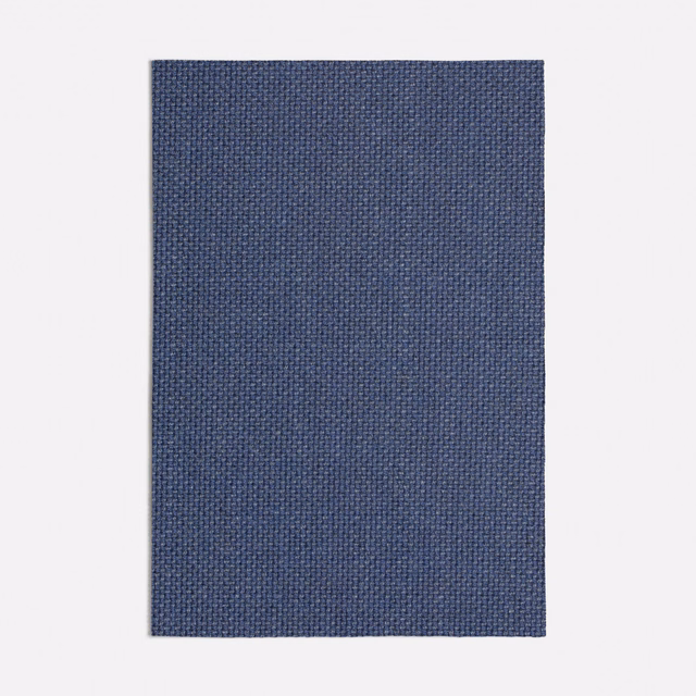 Deep slate-blue textile showing a fine, tightly woven crosshatch surface