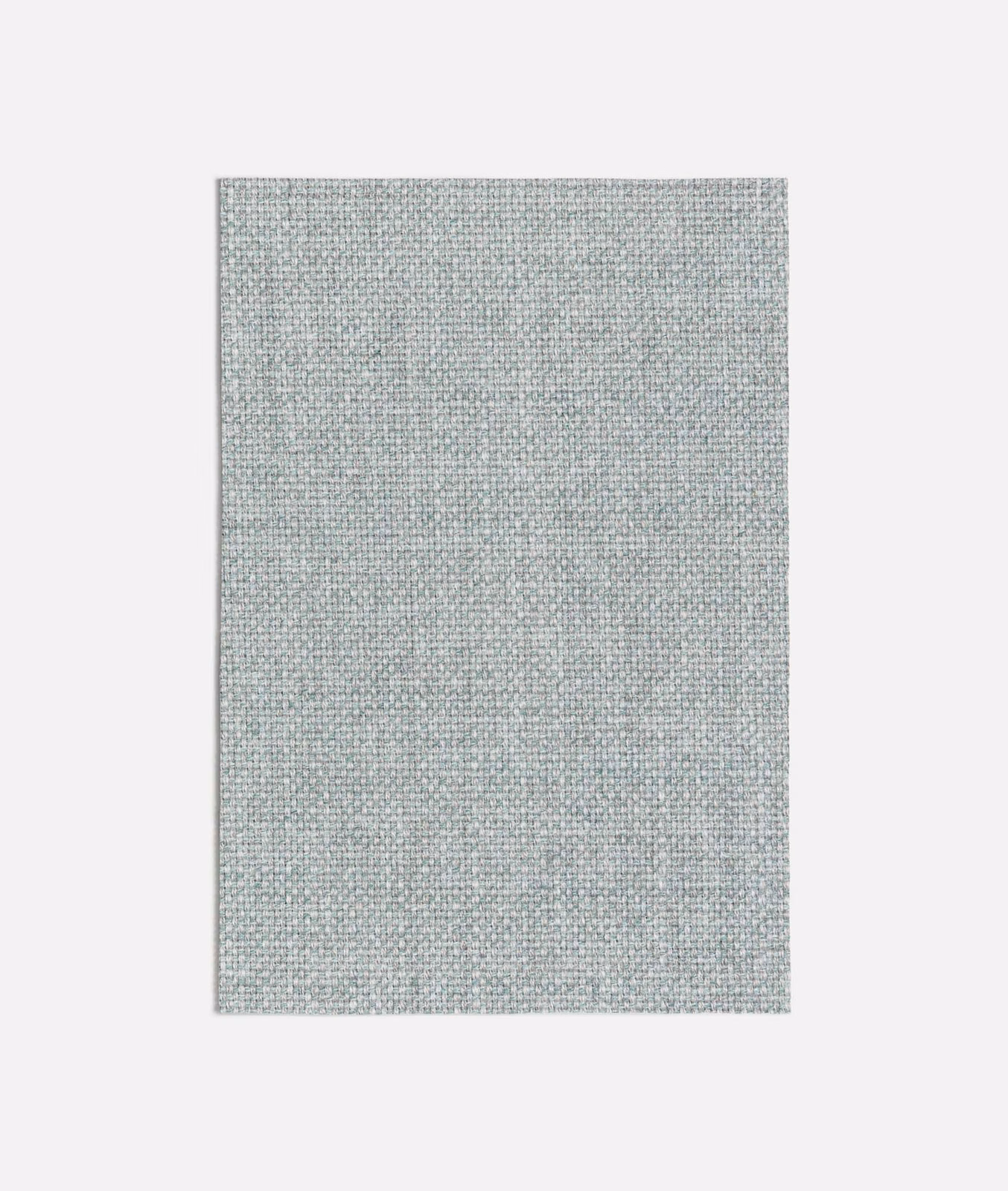 Close view of Zagora Blue’s pale blue-grey plain weave with fine mottling