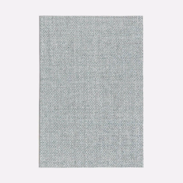 Close view of Zagora Blue’s pale blue-grey plain weave with fine mottling