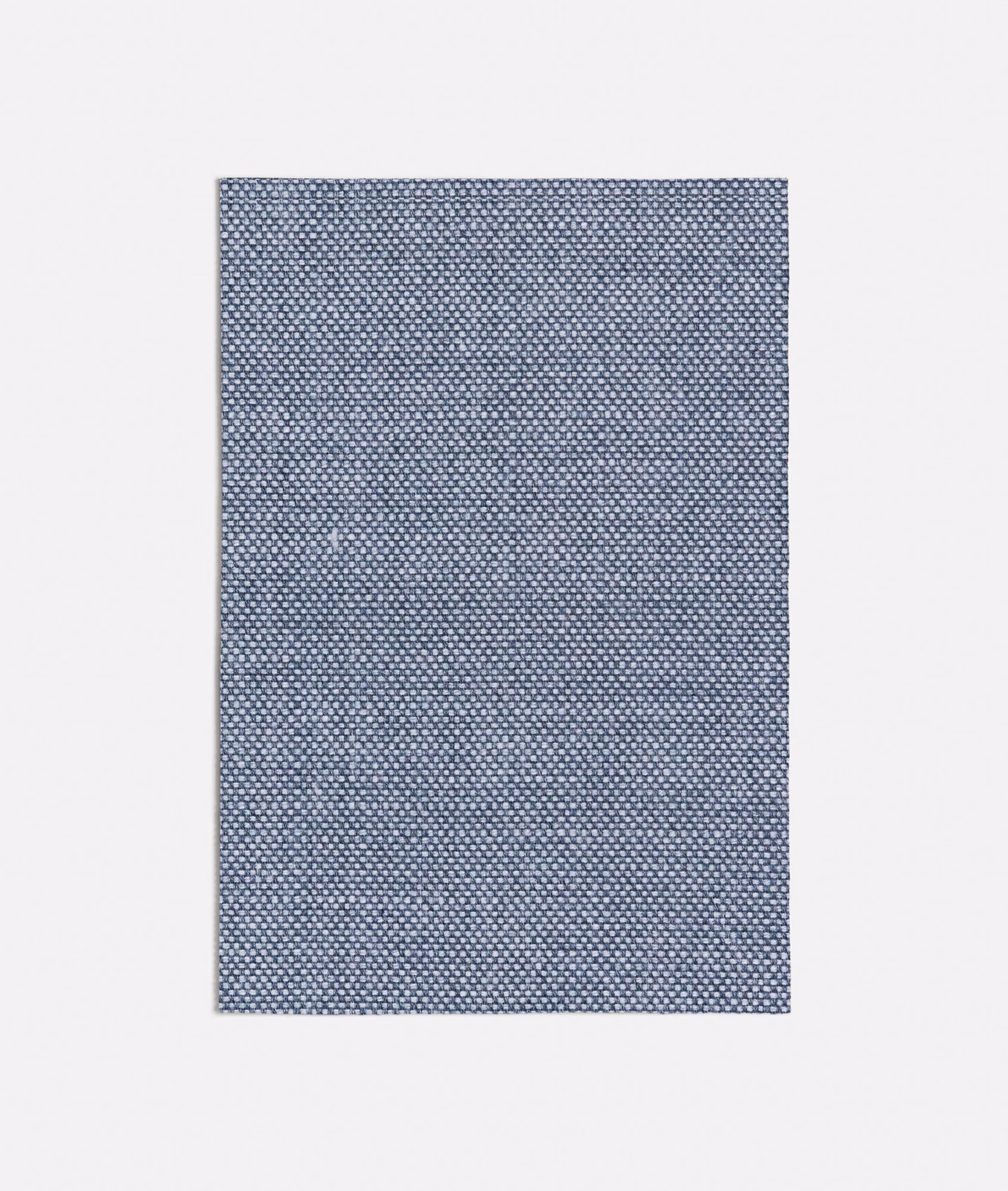 Cool blue-grey woven fabric with dense tiny geometric flecks and crisp texture
