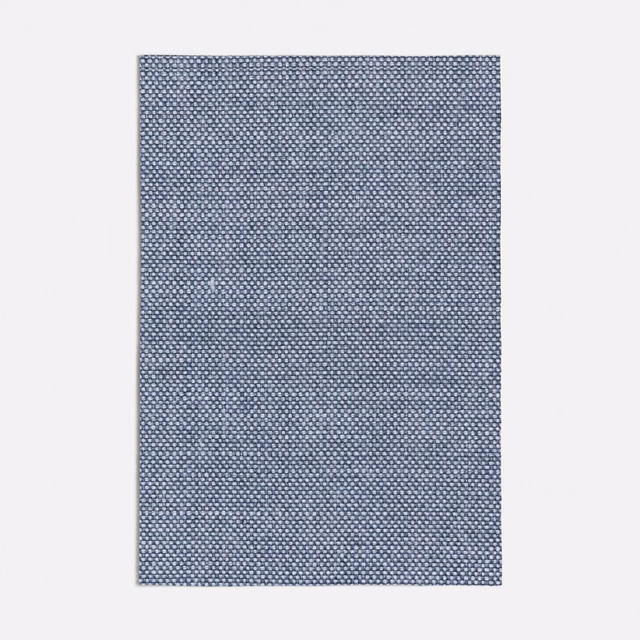 Cool blue-grey woven fabric with dense tiny geometric flecks and crisp texture