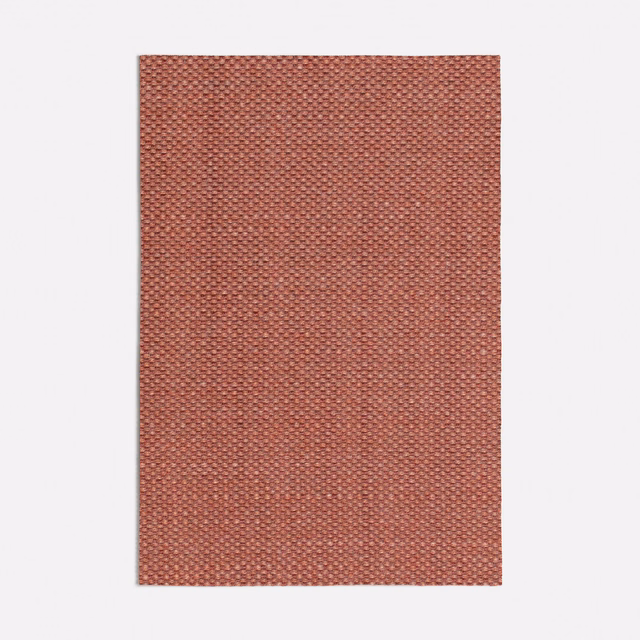 Warm cherry-pink woven swatch with a tiny, evenly spaced crosshatch texture