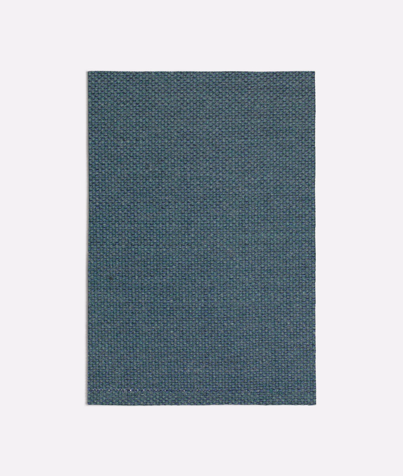 Dark seafoam teal fabric with a fine mottled woven texture
