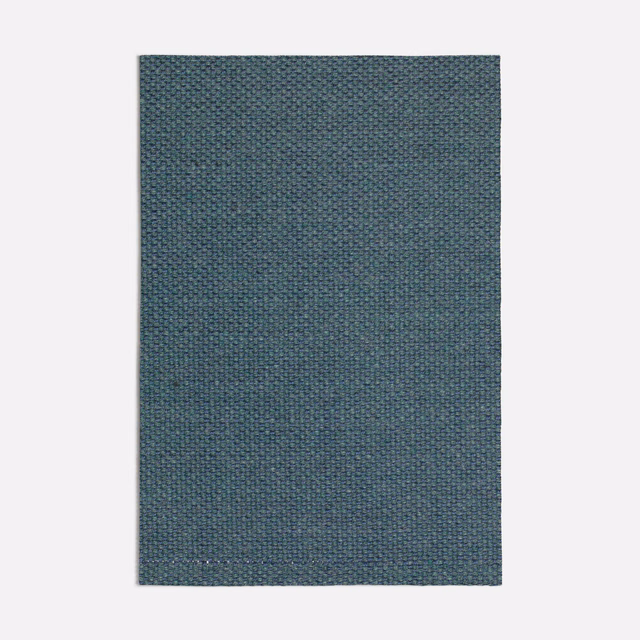 Dark seafoam teal fabric with a fine mottled woven texture