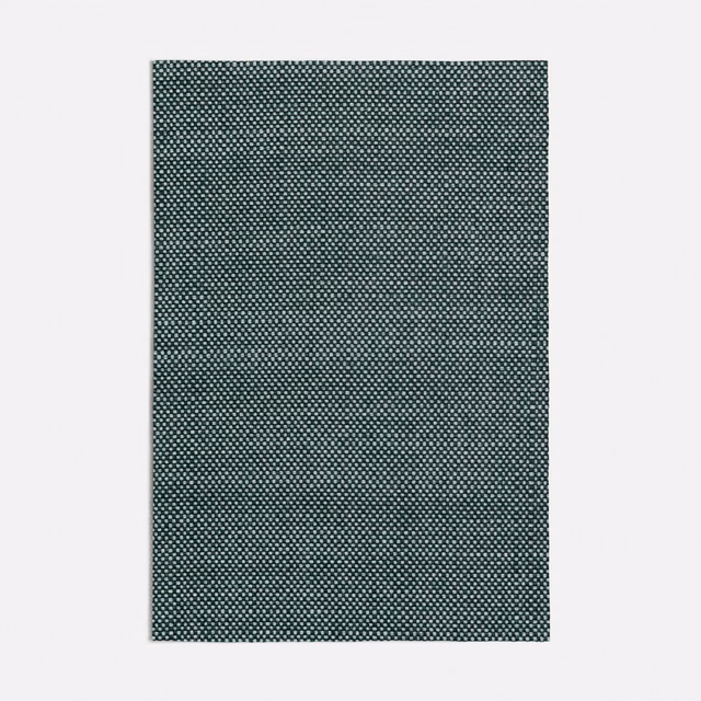 Deep forest green fabric with a tightly woven miniature pale geometric pattern