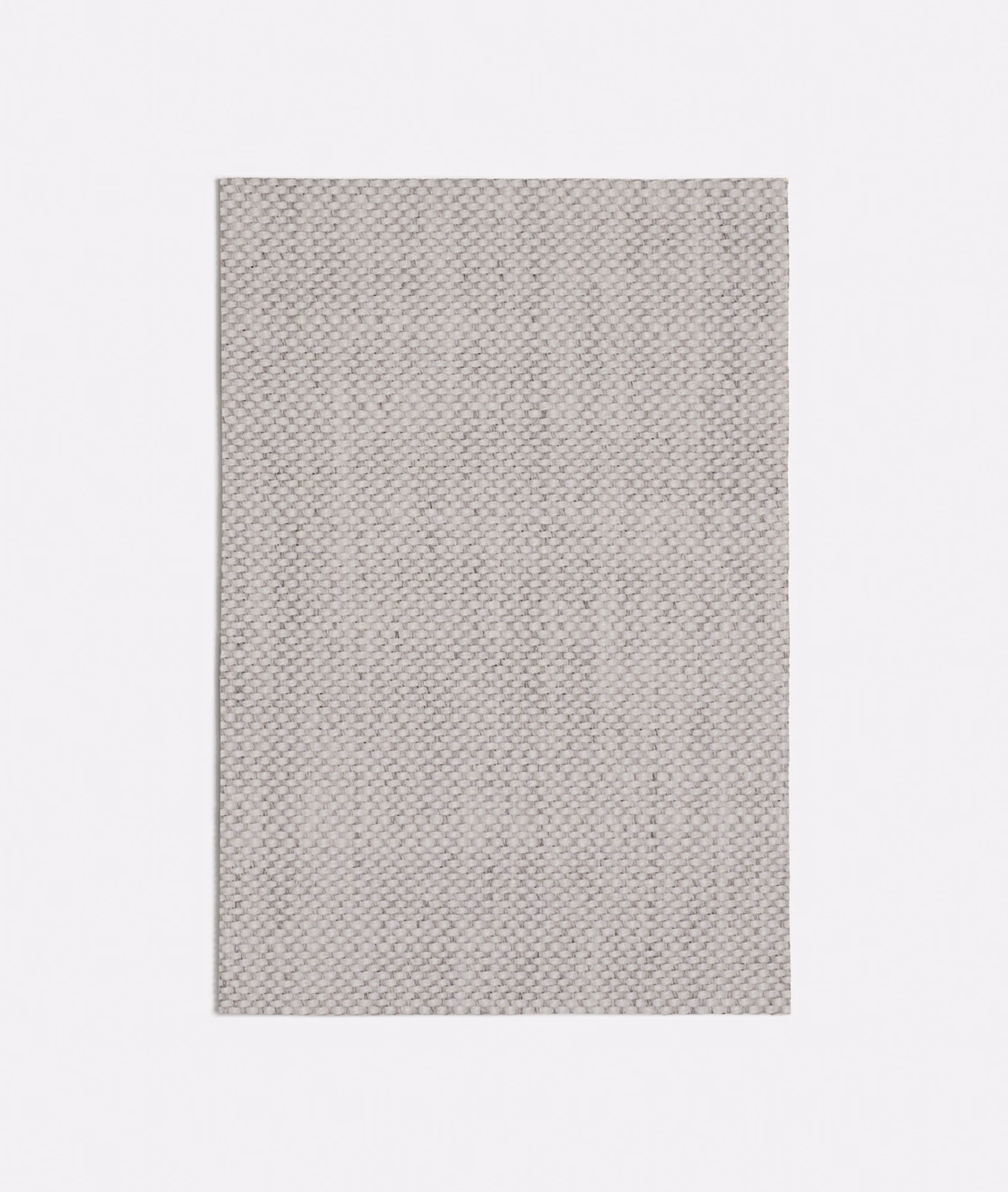 Soft warm grey textile showing a tiny interlocking weave and finely granular surface
