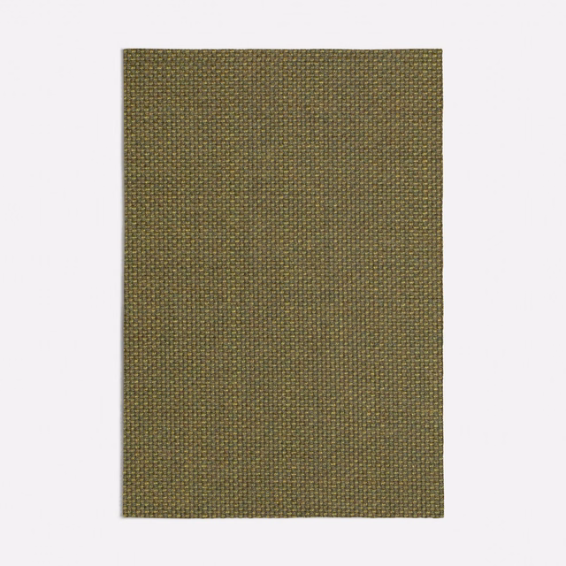 Muted pistachio olive fabric with fine brown threads in a tight plain weave