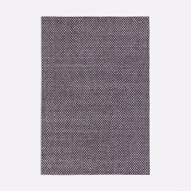 Cool plum-purple woven swatch with a tiny pale geometric peppered texture