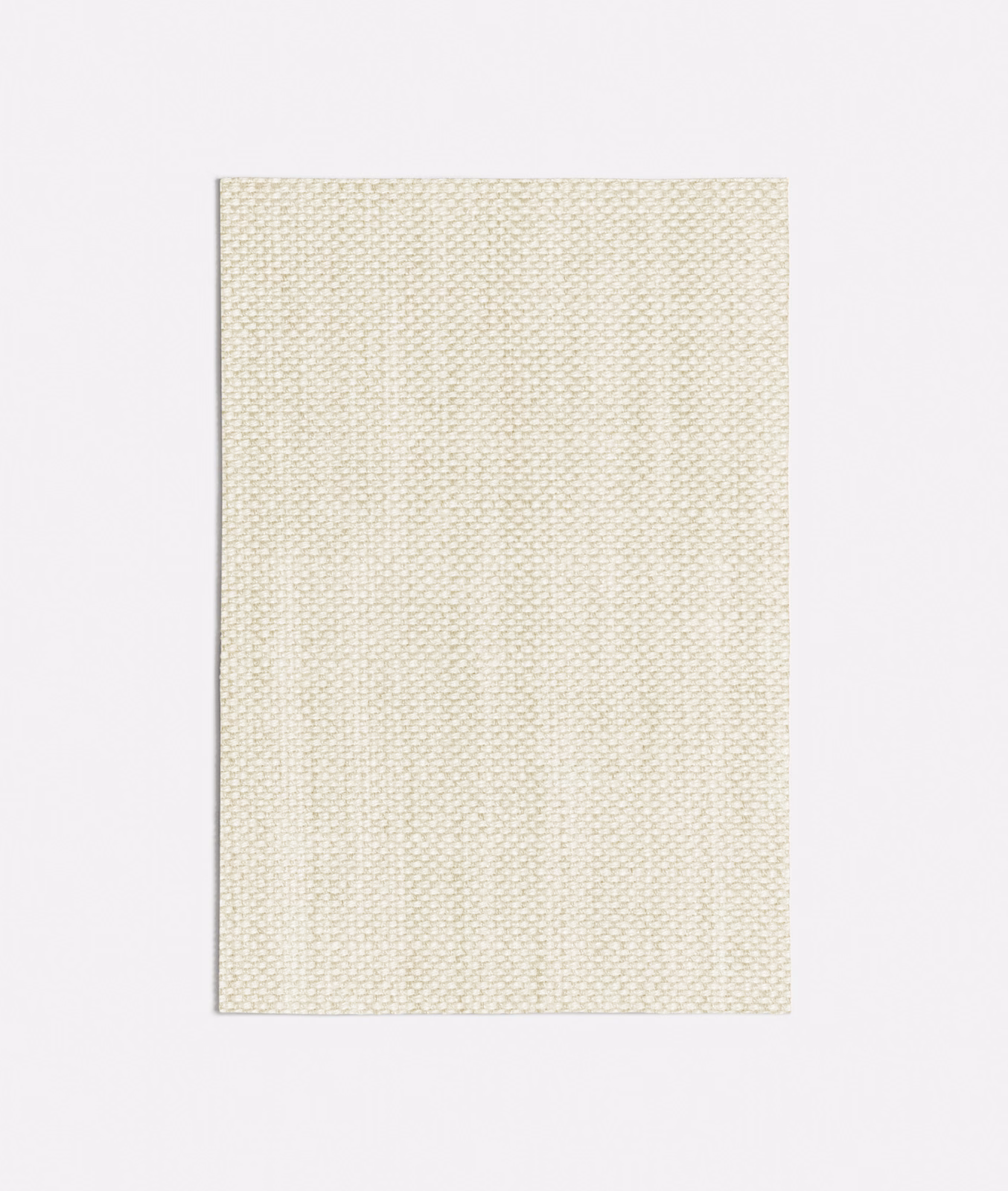 Close view of pale sand fabric with a fine, tightly textured woven surface