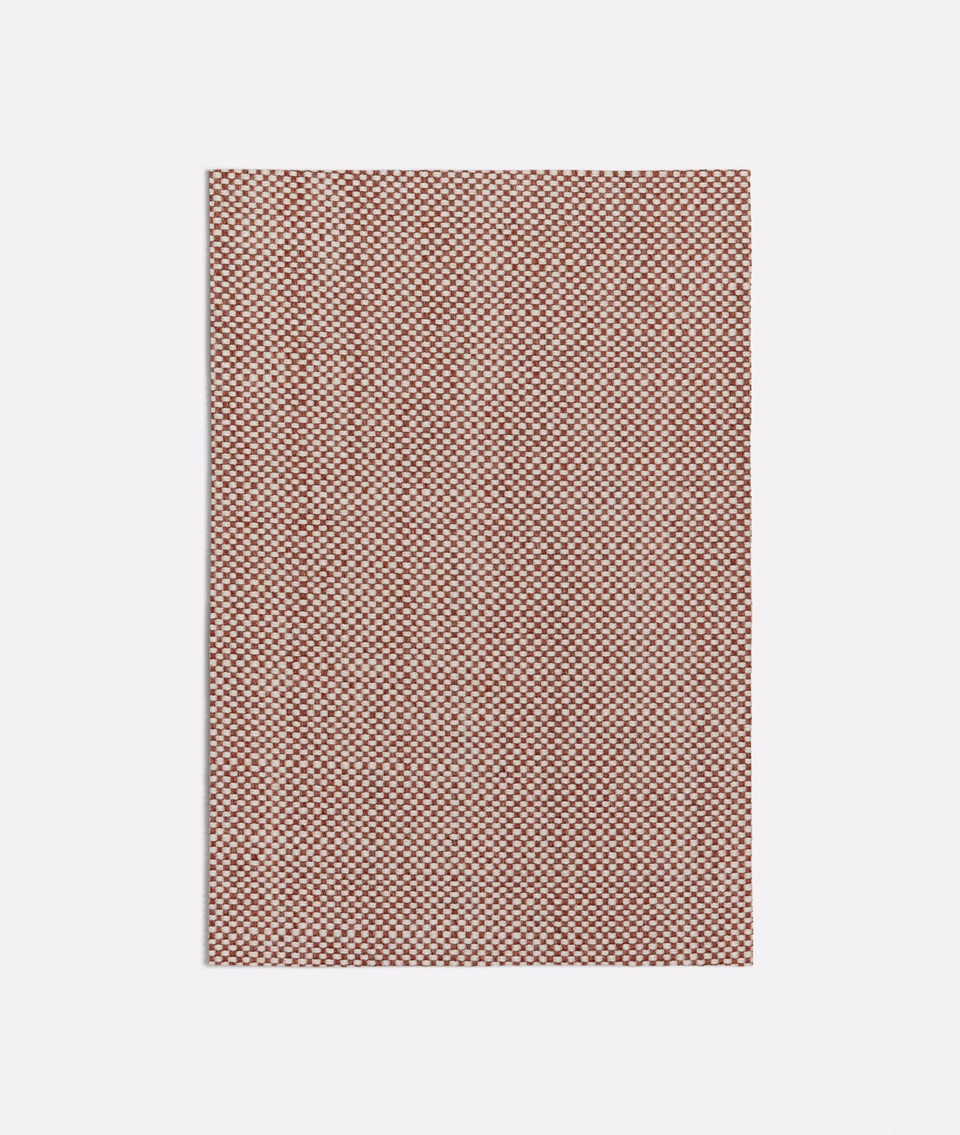Dense terracotta and pale cream micro-check woven fabric swatch with softly mottled texture