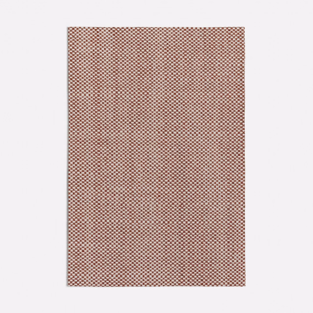 Dense terracotta and pale cream micro-check woven fabric swatch with softly mottled texture