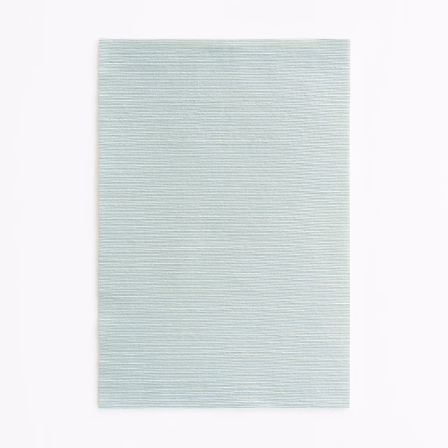 Pale aqua textile swatch with fine horizontal striations and a softly blended surface