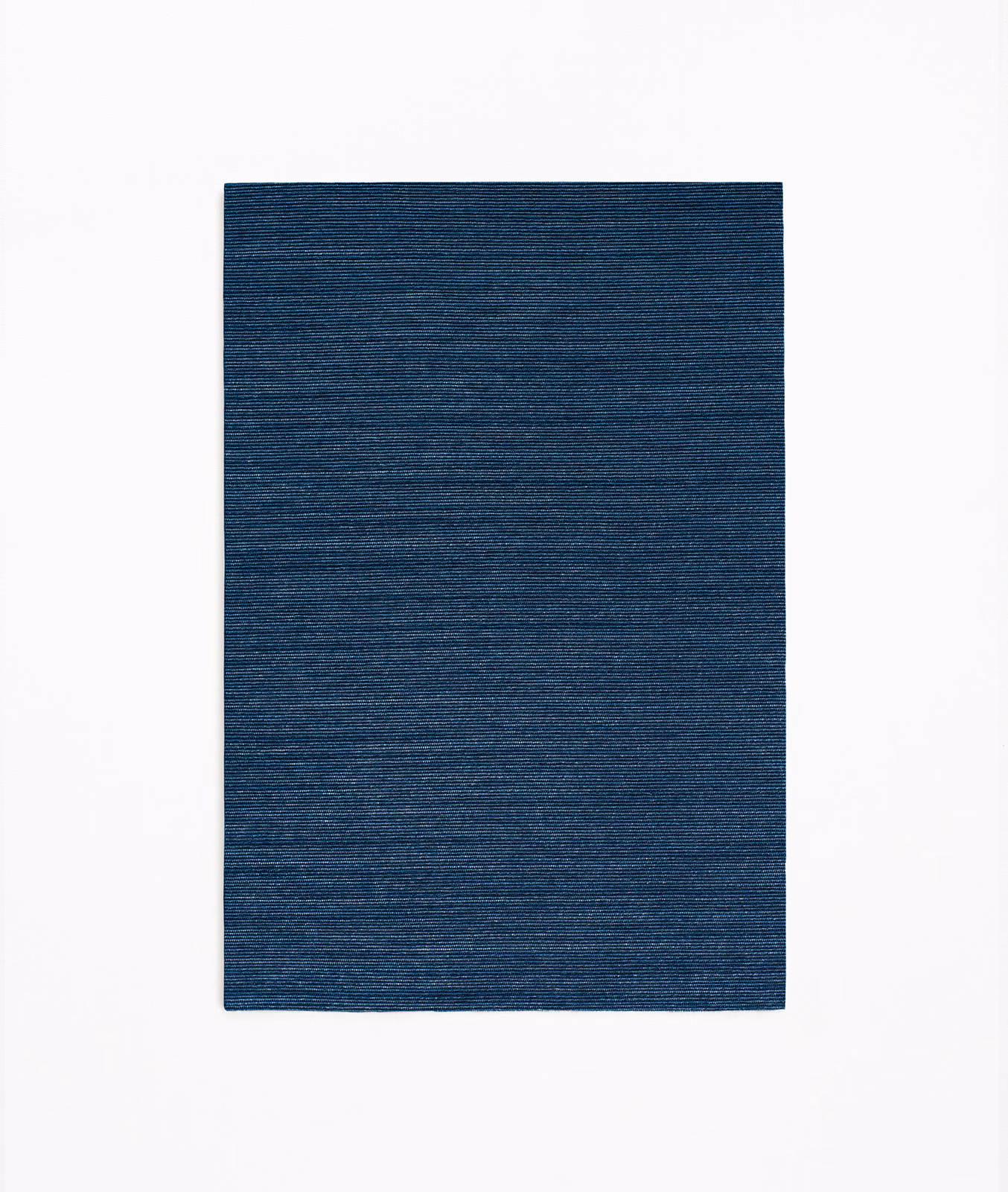Deep navy-blue textile swatch with fine horizontal slub lines and subtle tonal variation