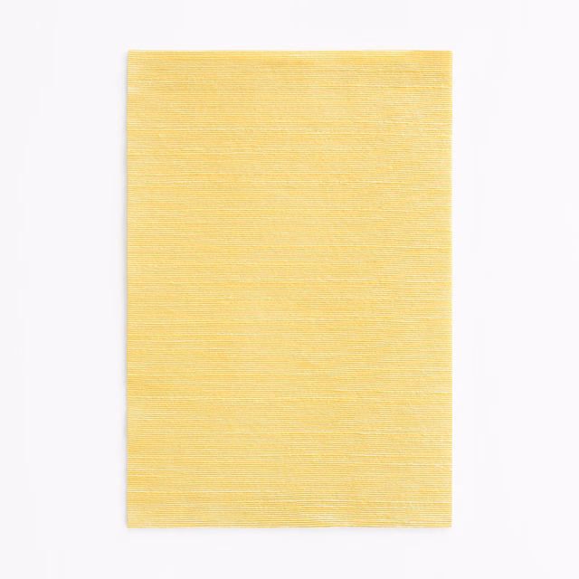 Pale canary-yellow fabric swatch with fine horizontal slub lines and soft texture