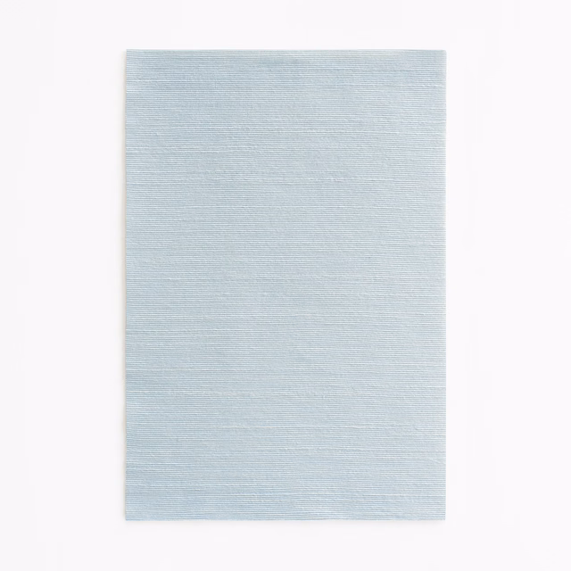 Pale icy-blue Dedar fabric swatch with fine horizontal woven texture