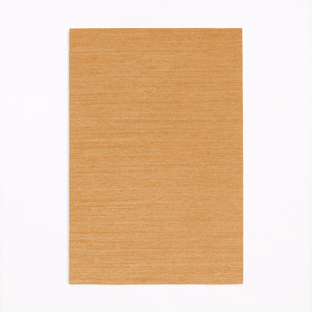 Warm terracotta woven swatch with fine horizontal striations and a softly textured surface