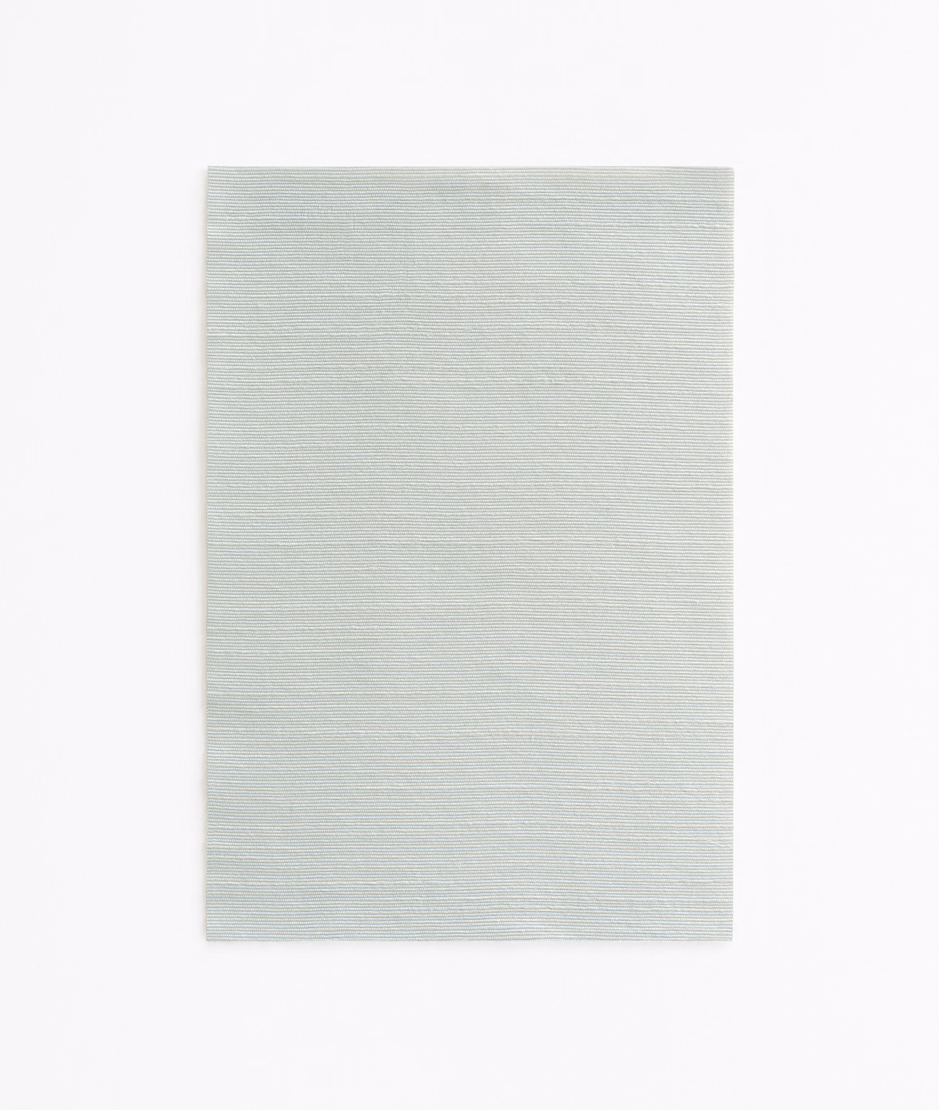 Pale ice-blue fabric swatch with fine horizontal woven texture
