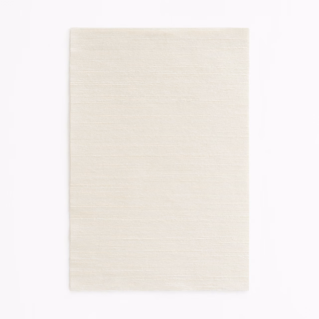 Pale ivory woven swatch with fine horizontal striations and a softly tactile surface