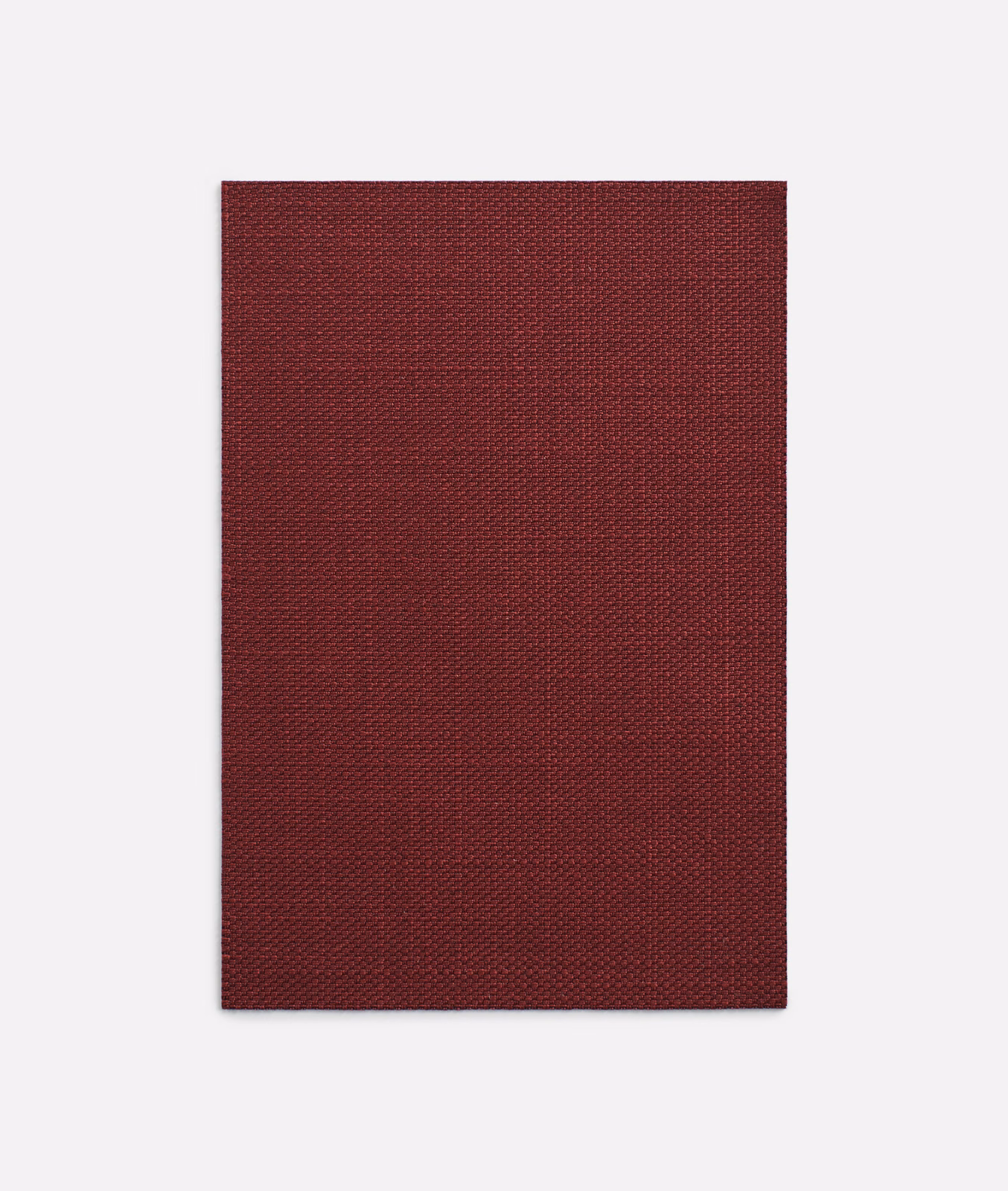 Deep burgundy textile swatch showing a dense, finely textured woven surface