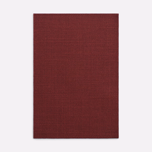Deep burgundy textile swatch showing a dense, finely textured woven surface