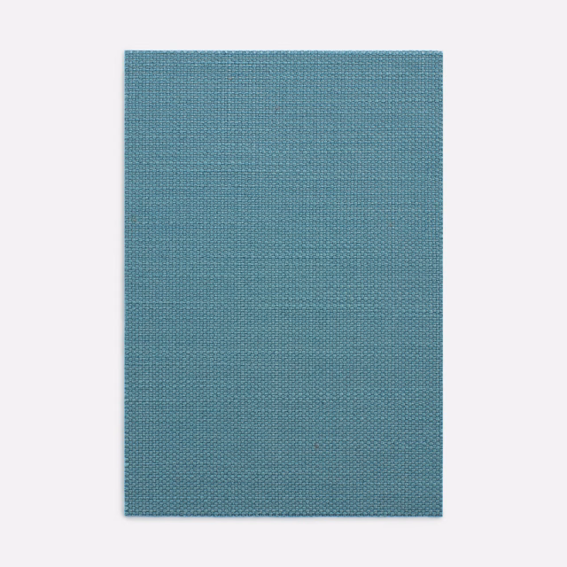 Muted blue-teal fabric swatch with a fine, even woven crosshatch texture
