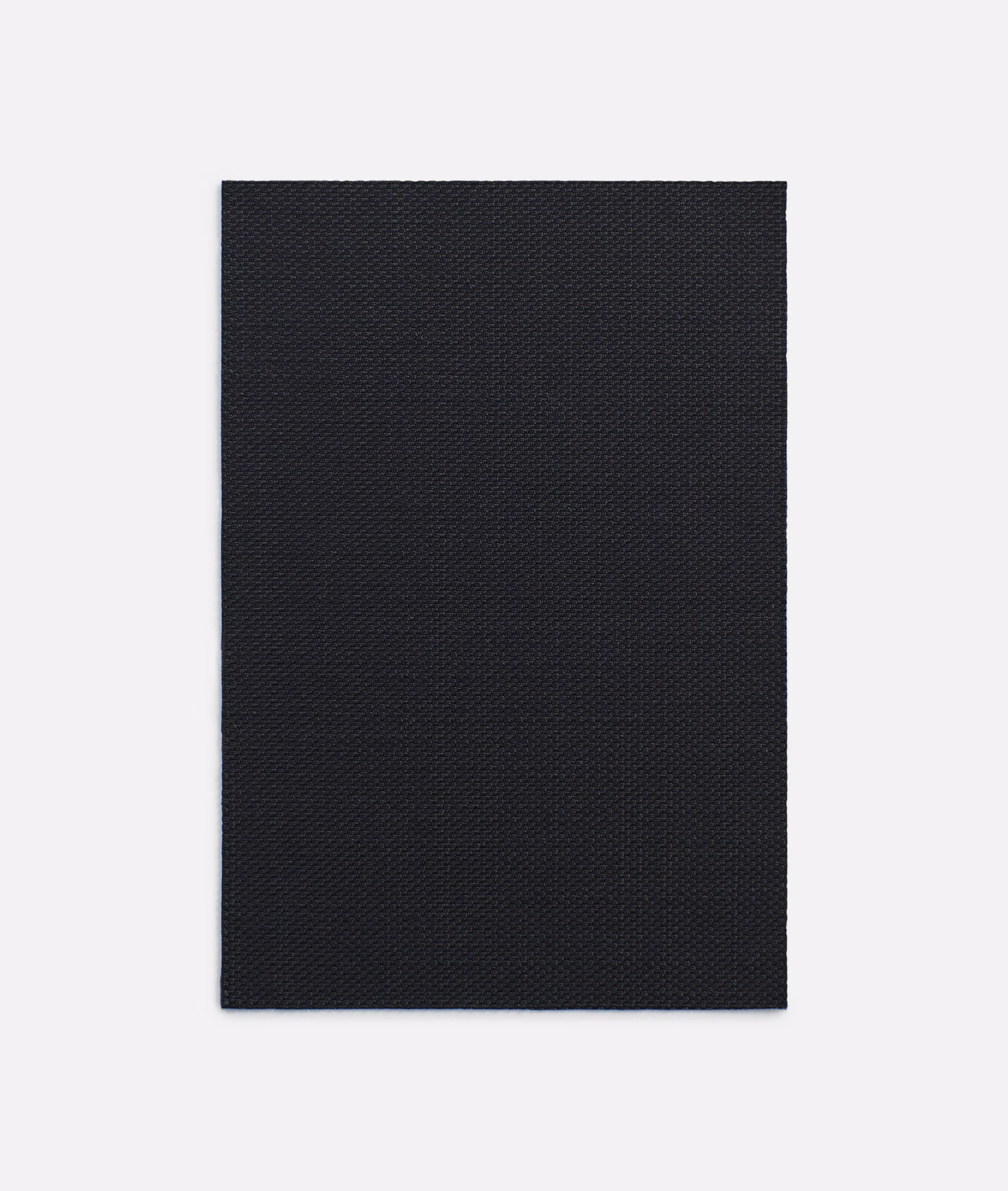 Near-black Amaretto Nero fabric with a fine, shadowed diagonal micro-weave