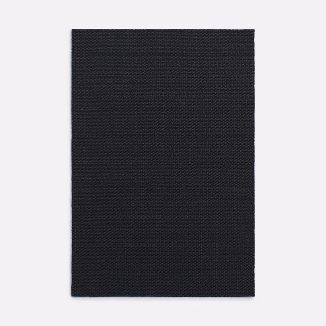 Near-black Amaretto Nero fabric with a fine, shadowed diagonal micro-weave