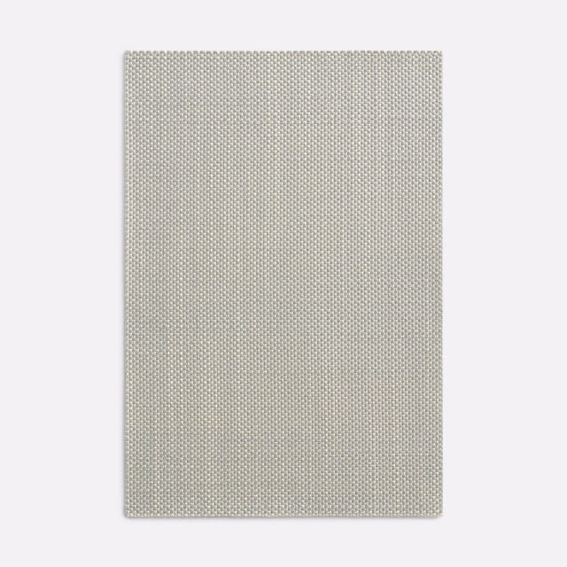 Pale greige Amaretto Perla swatch showing a fine, tightly repeating woven texture
