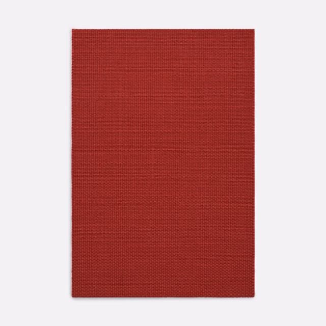 Deep brick-red woven fabric swatch with fine horizontal and vertical texture