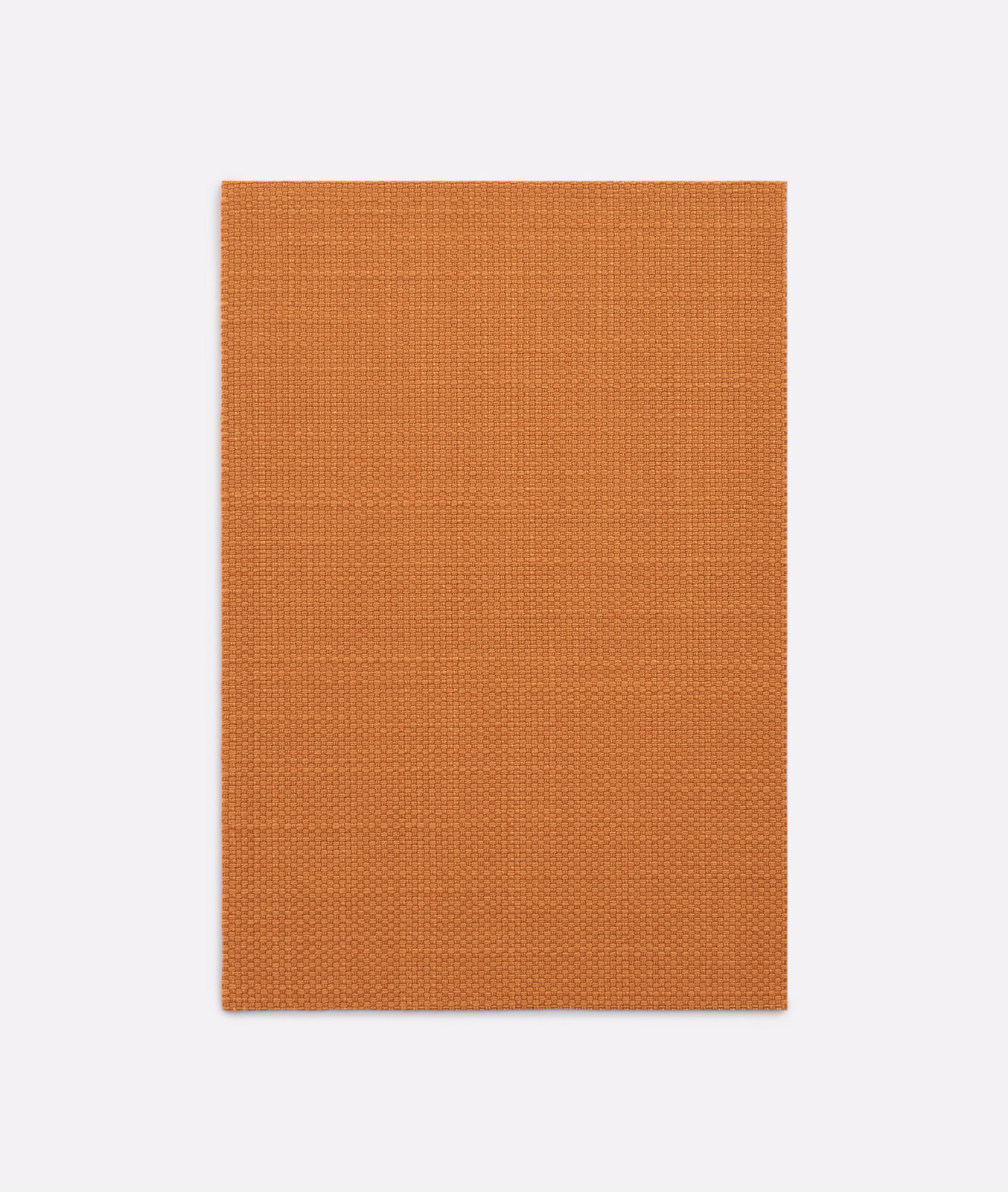 Burnt terracotta Dedar textile with a fine, even crosshatched weave