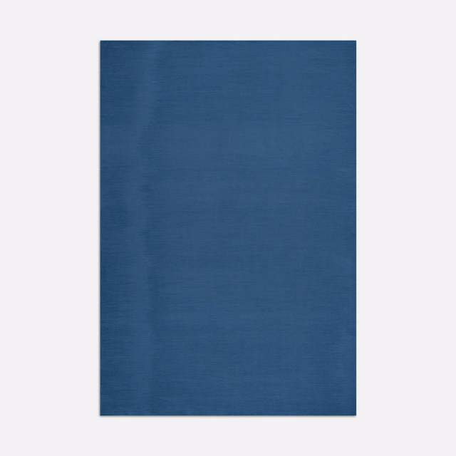 Deep Prussian-blue fabric swatch with subtle horizontal weave and cloudy tonal movement