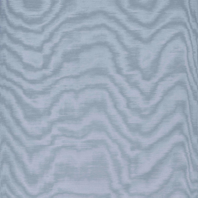 Pale blue-grey fabric with softly undulating, clouded woodgrain lines and a quiet sheen