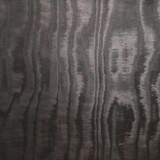 Charcoal-black textile with silver-grey vertical moiré waves and fine ribbed texture