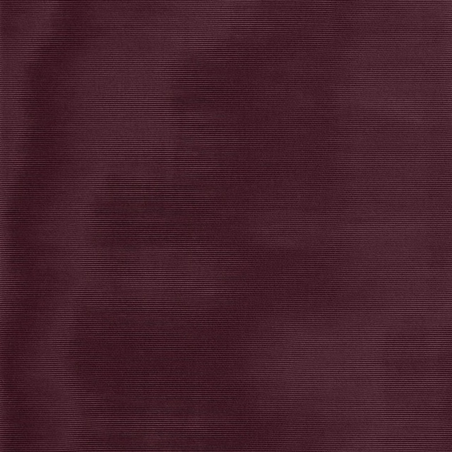 Close-up of deep aubergine fabric with fine horizontal ribbed texture