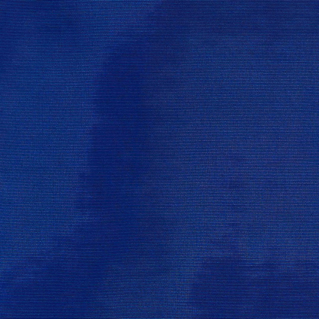 Deep cobalt blue fabric with fine horizontal ribs and soft shadowy tonal patches