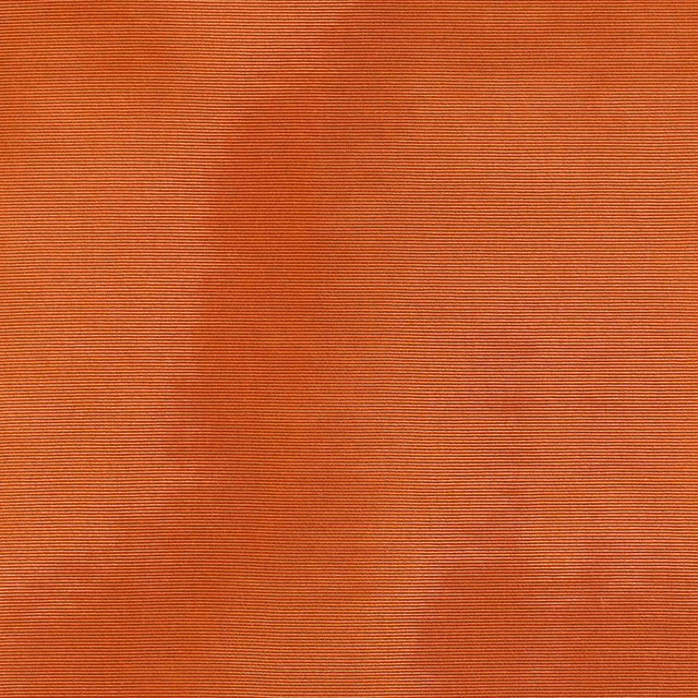 Mandarin orange textile with fine horizontal ribs and softly mottled tonal shading
