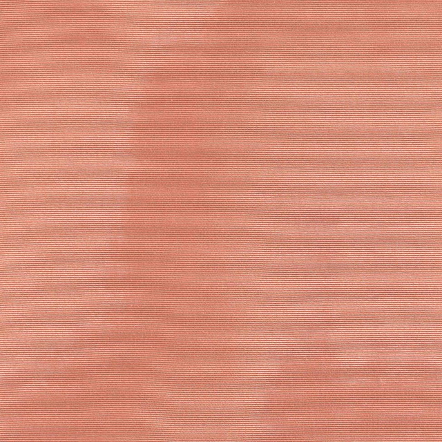 Muted salmon-pink fabric with fine horizontal ribs and softly clouded tonal variation