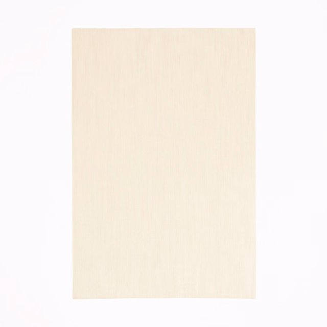 Pale quartz-rose fabric with fine vertical striations and a softly matte surface