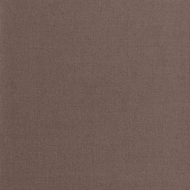 Close-up of warm mauve-taupe fabric with a fine, even woven texture