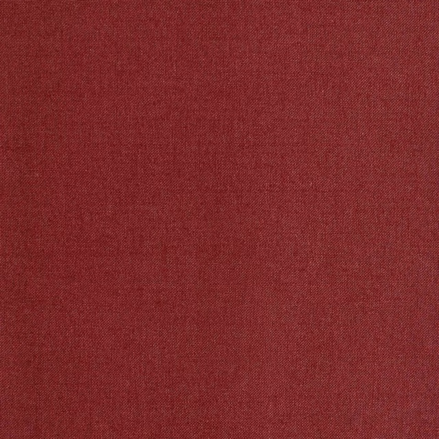 Deep ciliegia red textile with a fine, subtly mottled plain weave