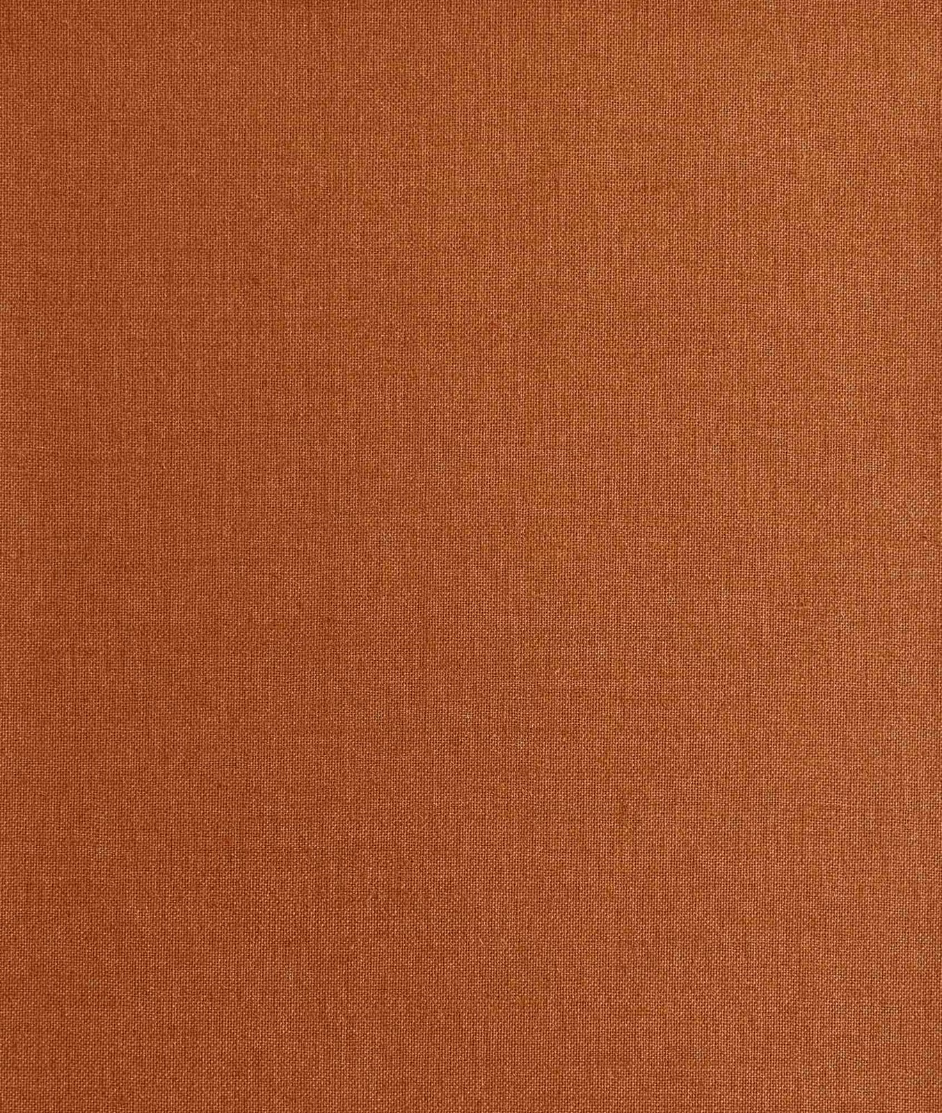 Fine woven fabric in warm rust terracotta with subtle tonal texture