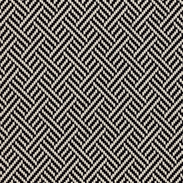 Black and ivory woven fabric with closely repeated geometric zigzag chevrons