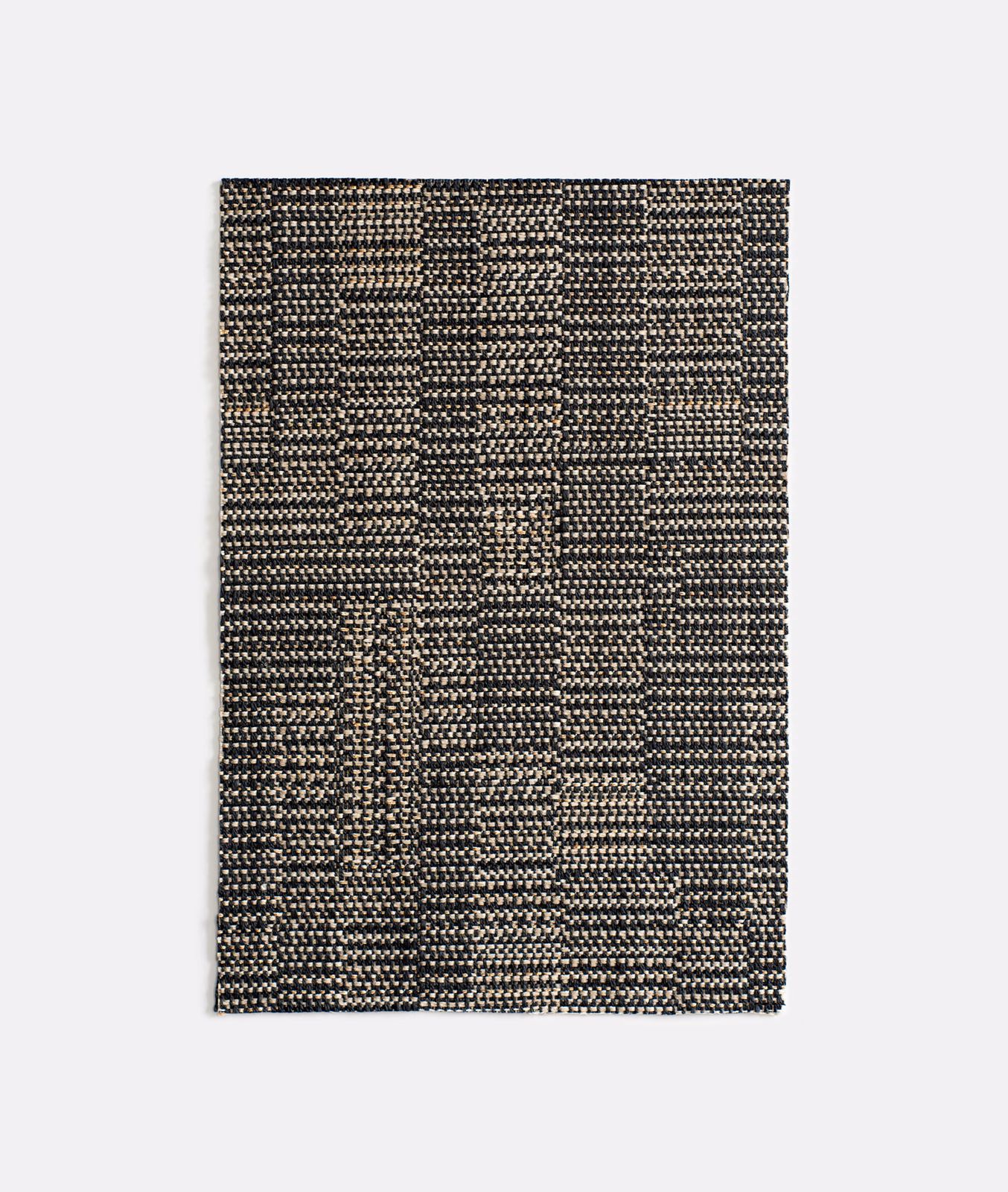 Charcoal and black geometric weave with warm beige flecks in Dilmun Lava
