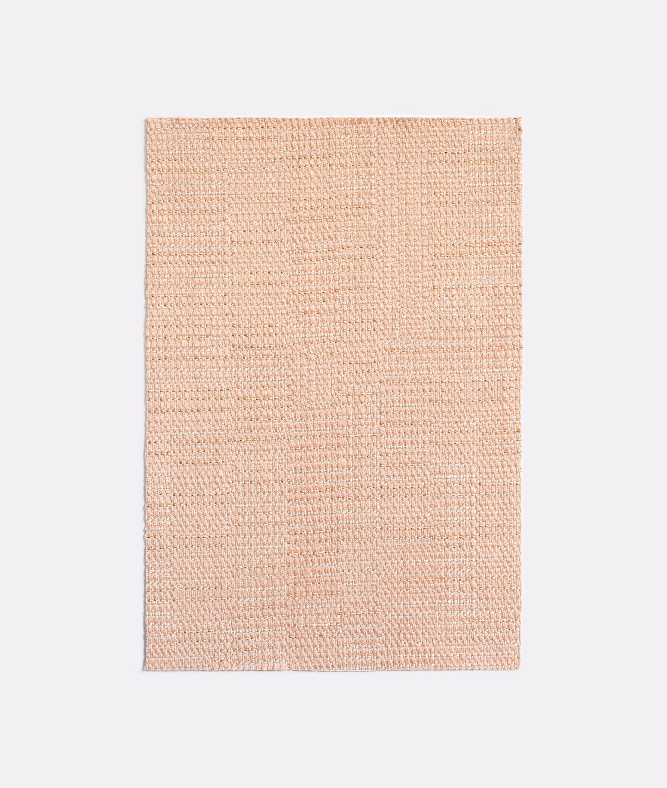Pale blush rose fabric with fine, subtly ridged woven texture