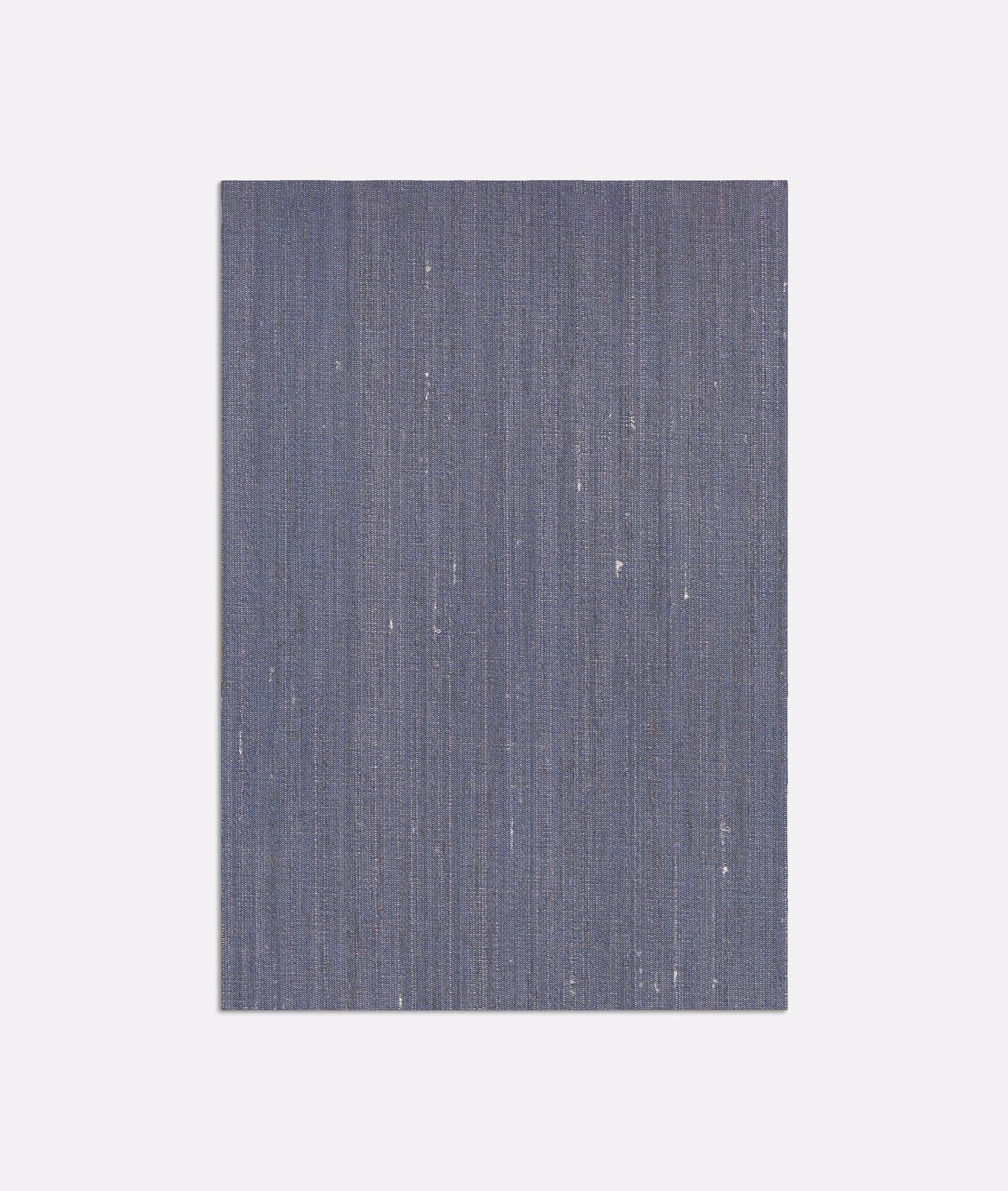 Slate blue-grey woven ground with fine vertical striations and scattered pale flecks