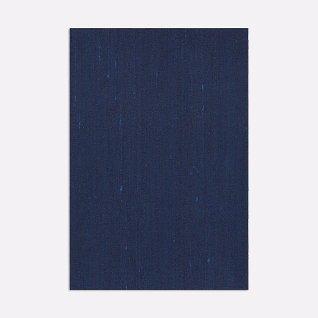 Deep navy woven swatch with fine vertical striations and scattered blue flecks