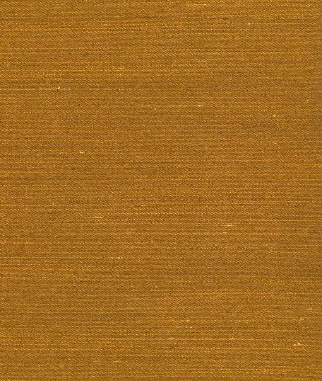 Warm antique-gold textile with fine horizontal slubs and scattered pale glints