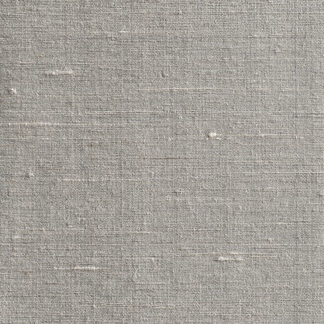 Close-up of cool mica-grey fabric with fine grid weave and subtle horizontal slubs